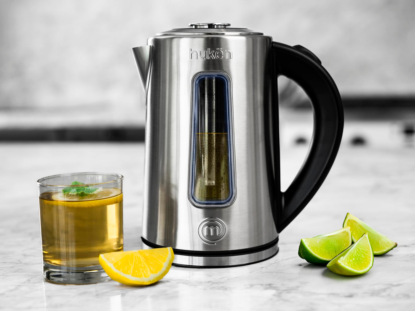 Hukën x MasterChef | Tetera Eléctrica Fuse+ con Infusor Removible | Hervidor de Vidrio/Acero Inoxidable | Base Giratoria 360° | Capacidad de 1.7 L | Calentador de Agua Rápido y Seguro (ON/OFF ACERO)