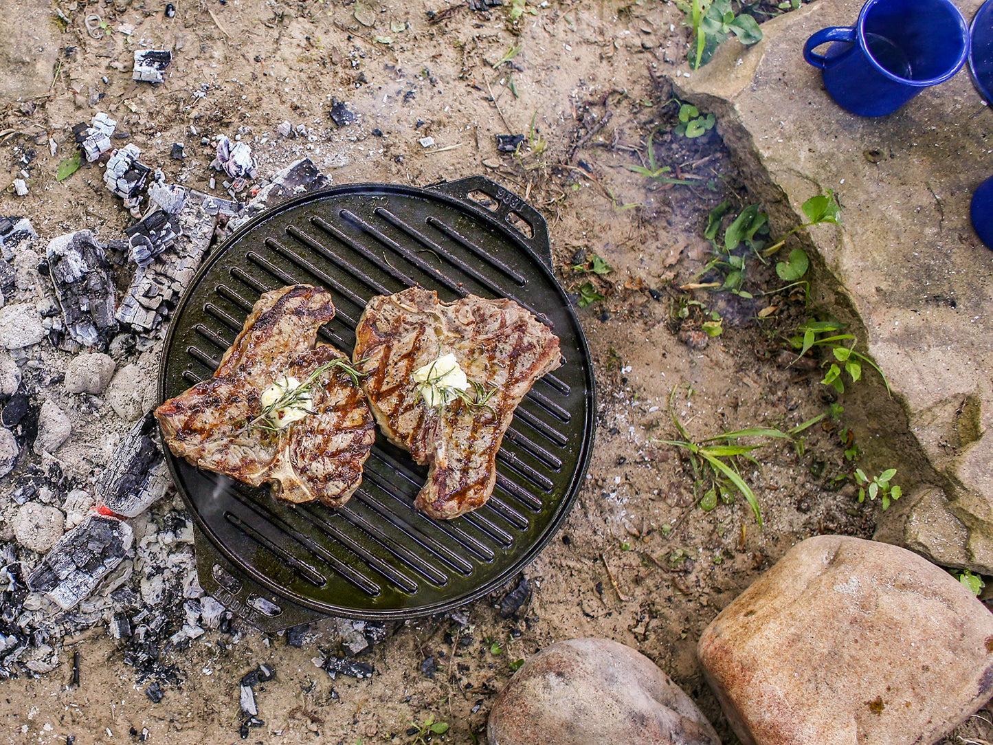 Lodge Cast Iron Cook-It-All Kit. Five-Piece Cast Iron Set Includes a Reversible Grill/Griddle 14 Inch, 6.8 Quart Bottom/Wok, Two Heavy Duty Handles, and a Tips & Tricks Booklet.