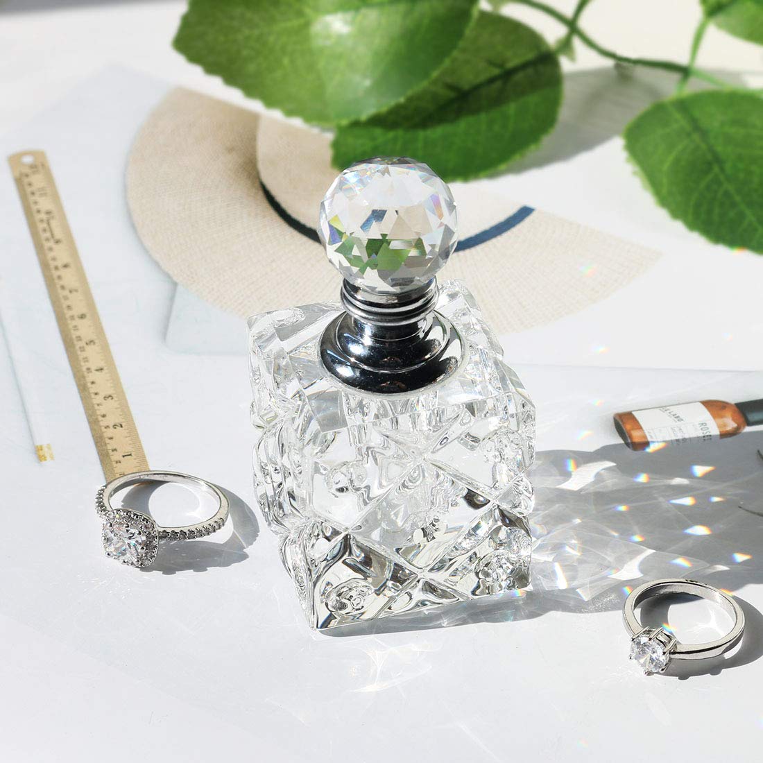Botella de perfume recargable de vidrio cúbico transparente para decoración