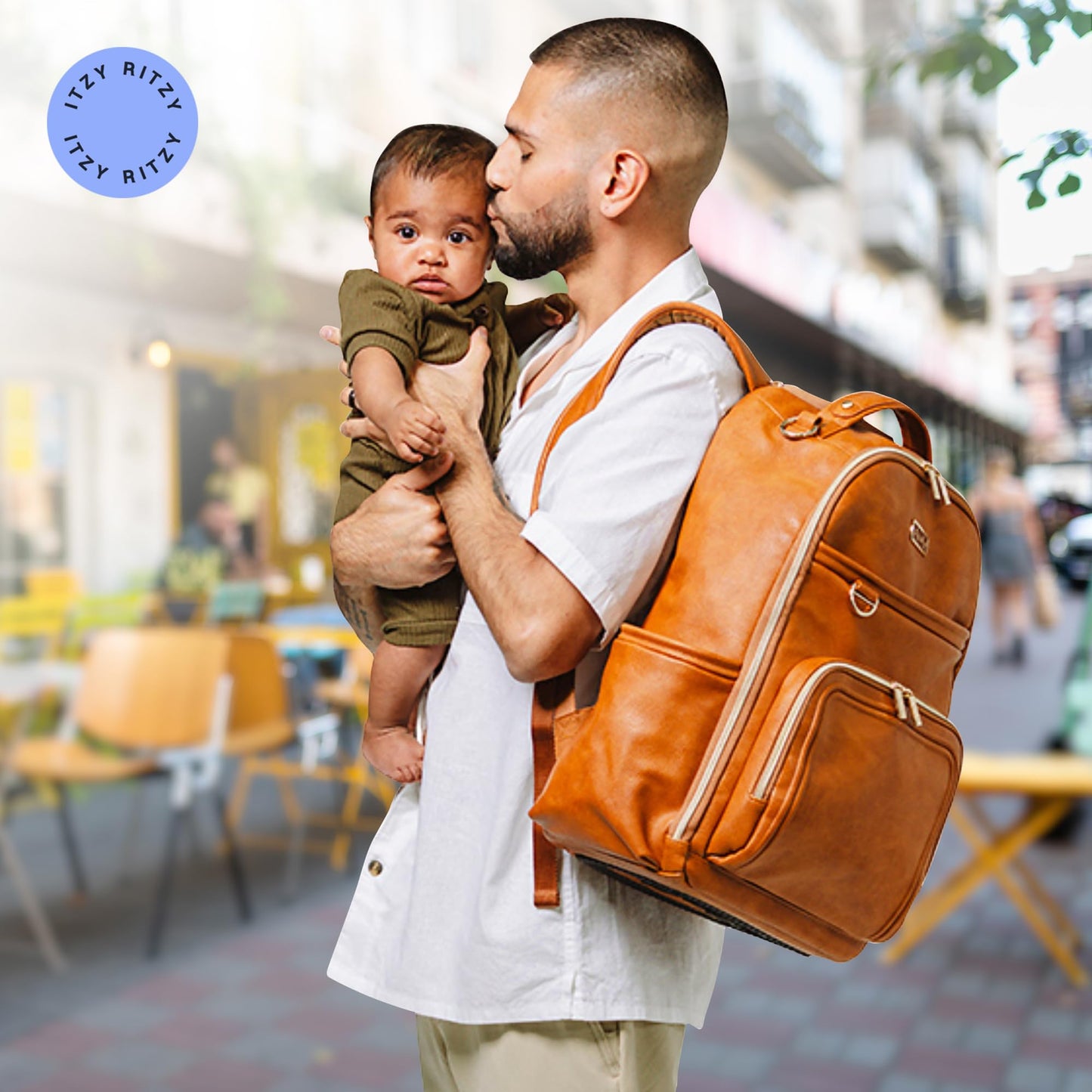 Itzy Ritzy - Mochila para pañales – Mochila de gran capacidad Boss Plus para bebé con 19 bolsillos, cambiador, clips para carriola y correas cómodas (coñac)