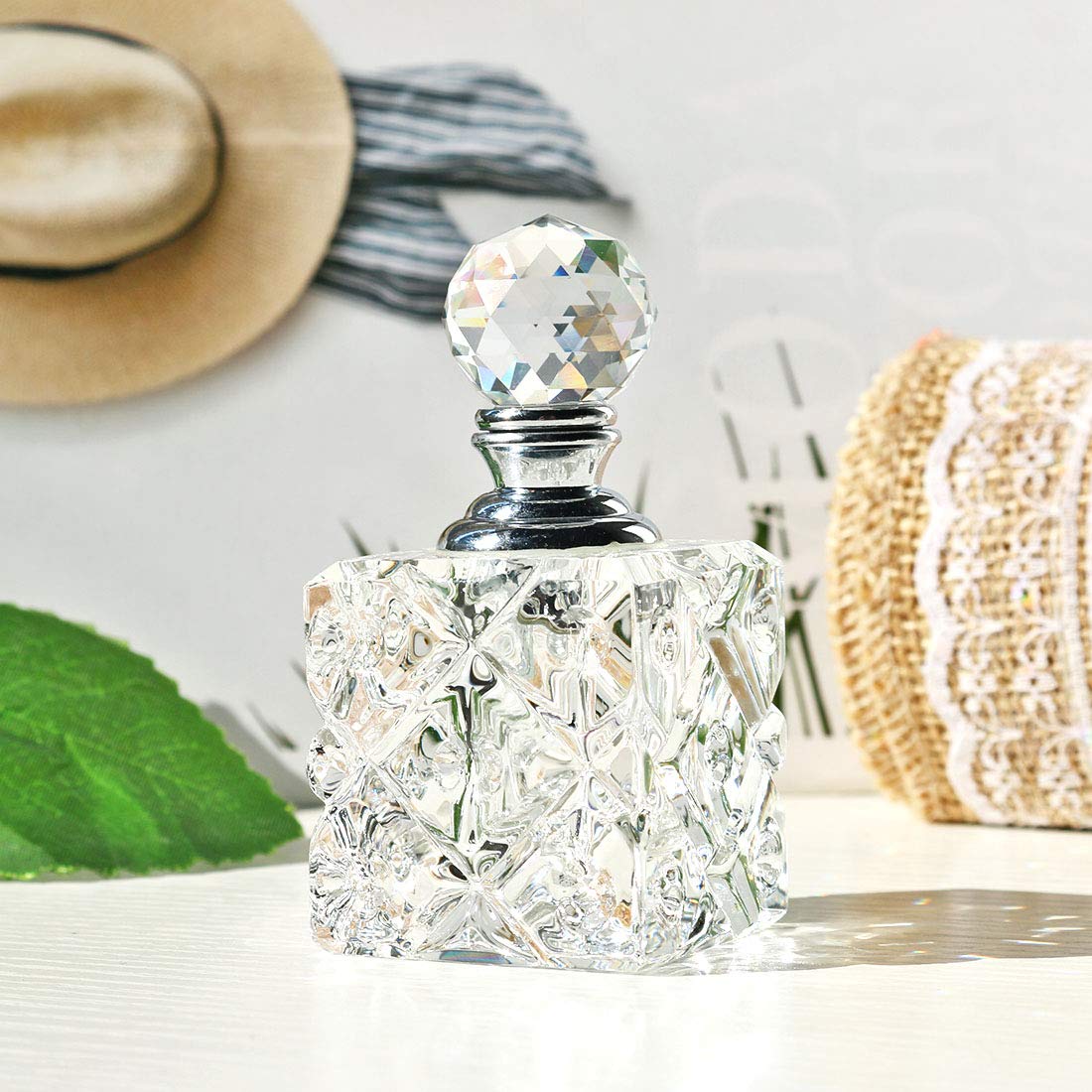 Botella de perfume recargable de vidrio cúbico transparente para decoración