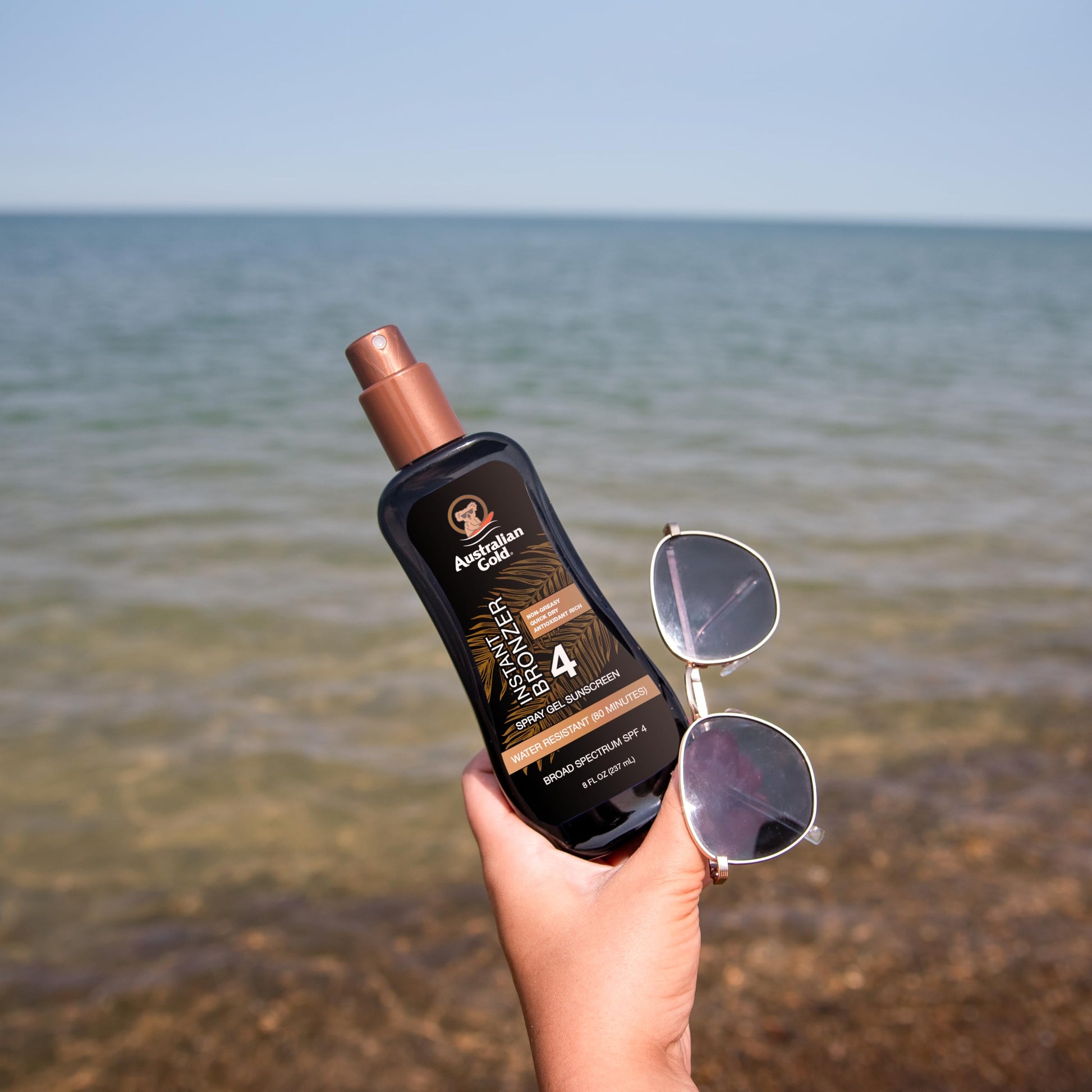 Australian Gold Spray Gel Sunscreen with Instant Bronzer SPF 4, 8 Ounce | Moisturize & Hydrate Skin | Broad Spectrum | Water Resistant | Non-Greasy | Oxybenzone Free | Cruelty Free