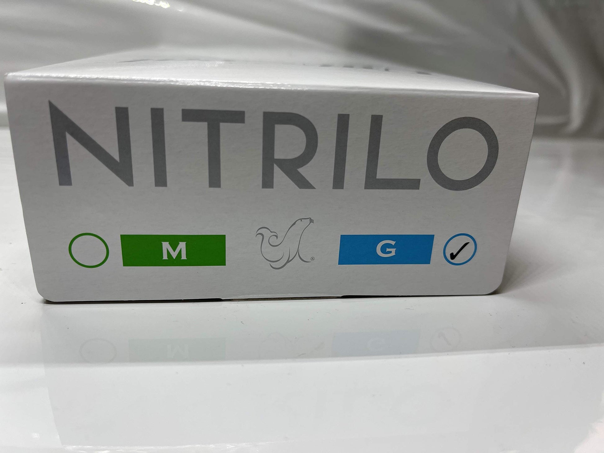 Guante de Nitrilo Uniseal Color Blanco Talla Mediana 100 piezas