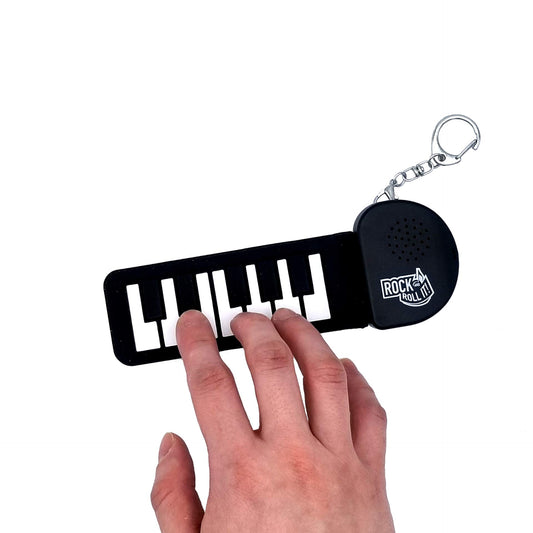 Rock and Roll It - Micro Piano. Llavero de piano de trabajo real y reproducible. Colgar en una mochila y jugar en cualquier lugar. Almohadilla de piano de dedo negro y blanco. Pequeño teclado