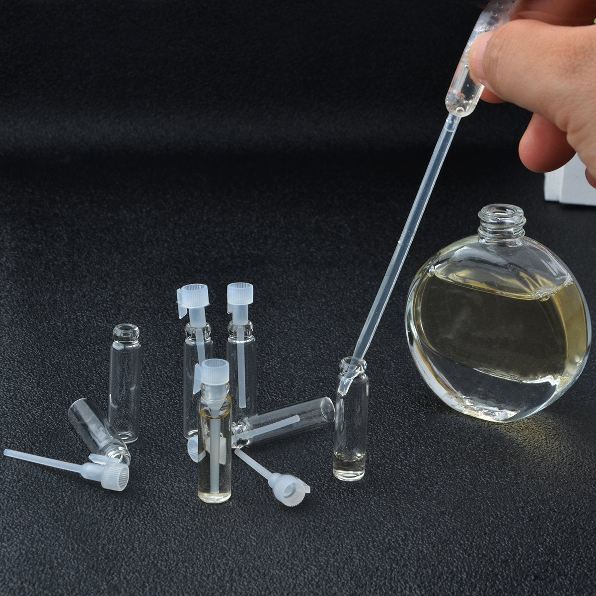 Enslz 1ml 100Pcs Mini Sample Cute Glass travel Oil Perfume Bottle With drop& Spray Empty Sample Bottle for Essential Oils Aromatherapy (1ml)