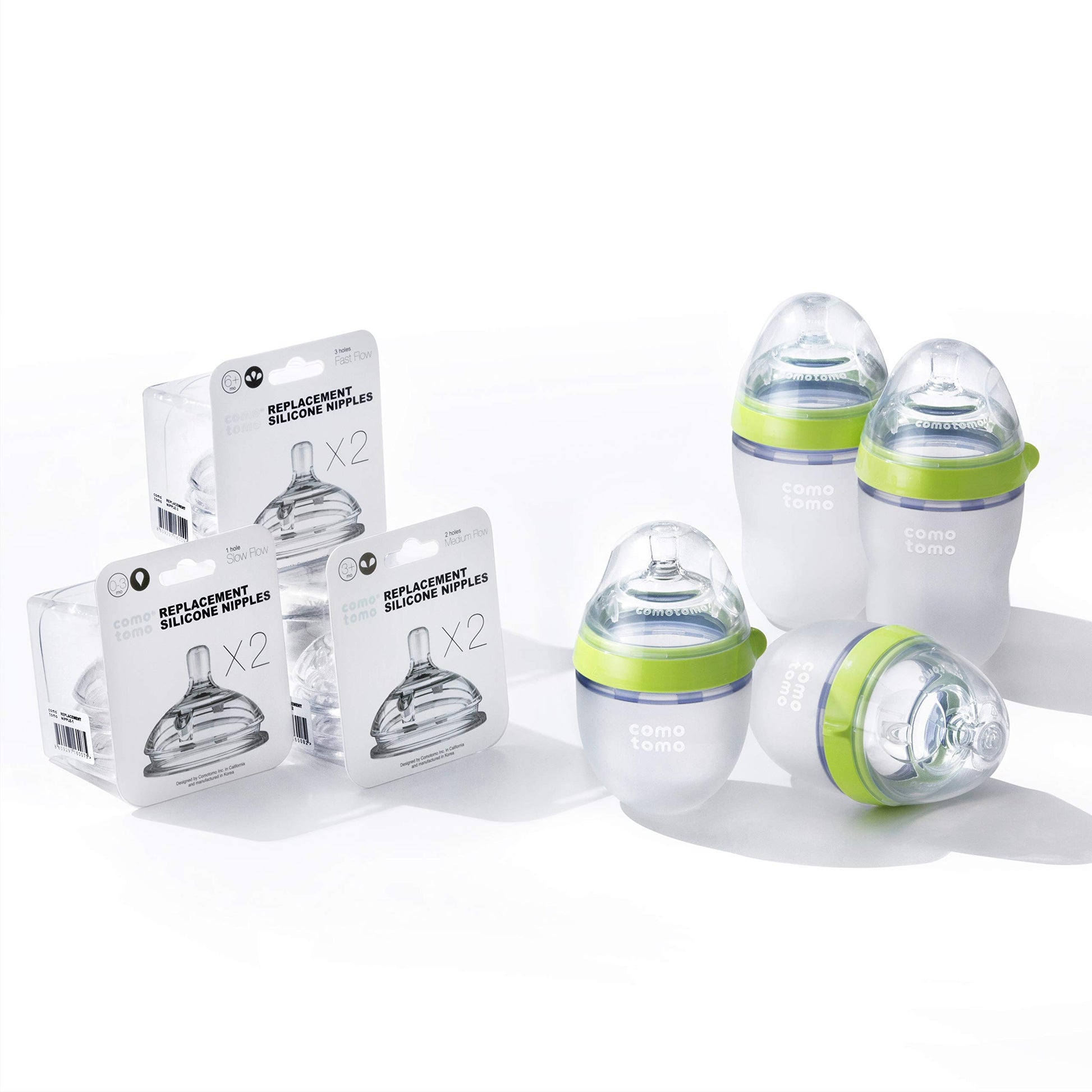 Comotomo Bundle de 4 Biberones de 2 X 150 Ml, 2 X 250 Ml, Anillo Verde, 3 Set de Tetinas Repuesto