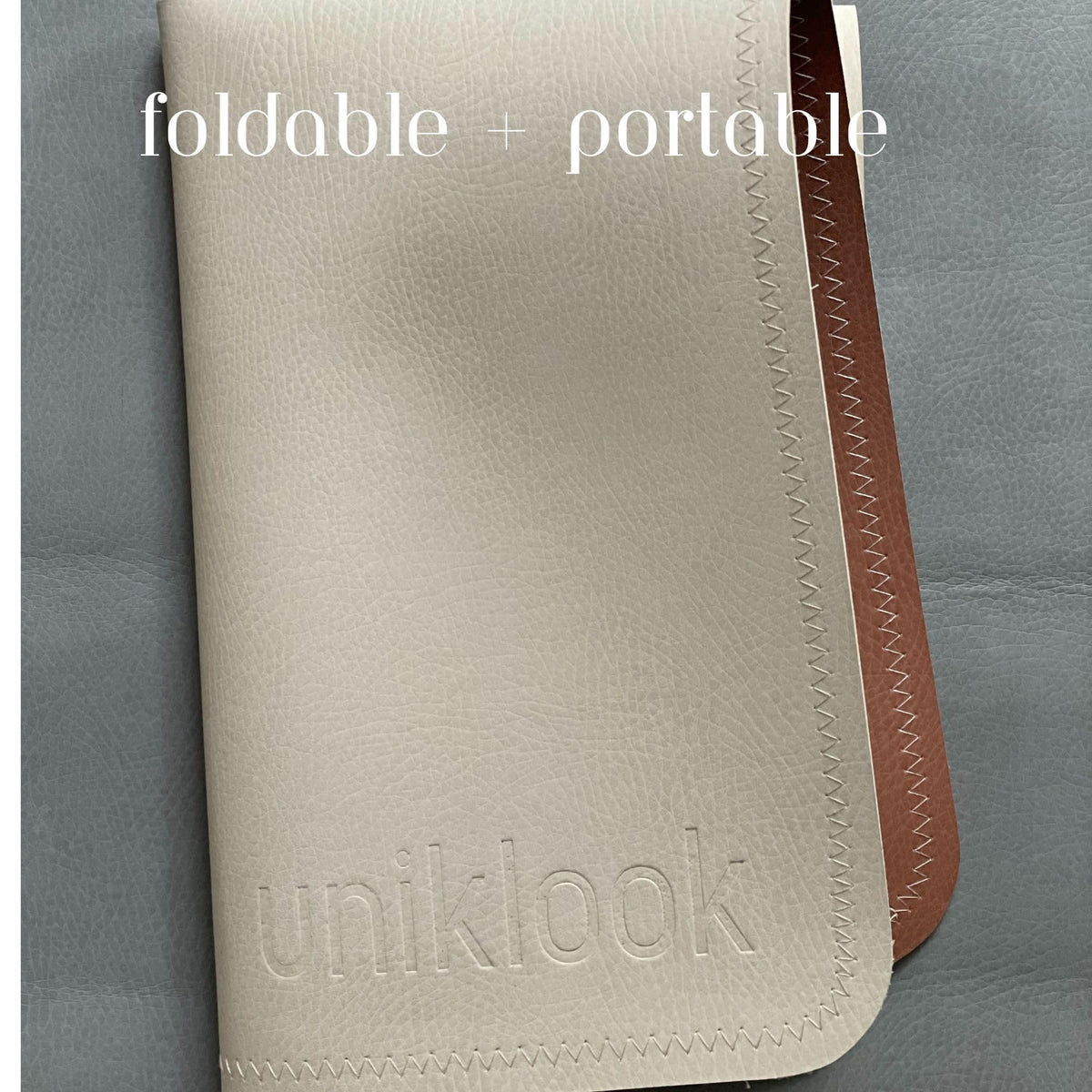 Uniklook - Cambiador de piel vegana para bebé bebé, impermeable, pañales, alfombrilla de colocación para mascotas o computadora, viaje portátil (16 x 30 pulgadas, marfil + terracota)