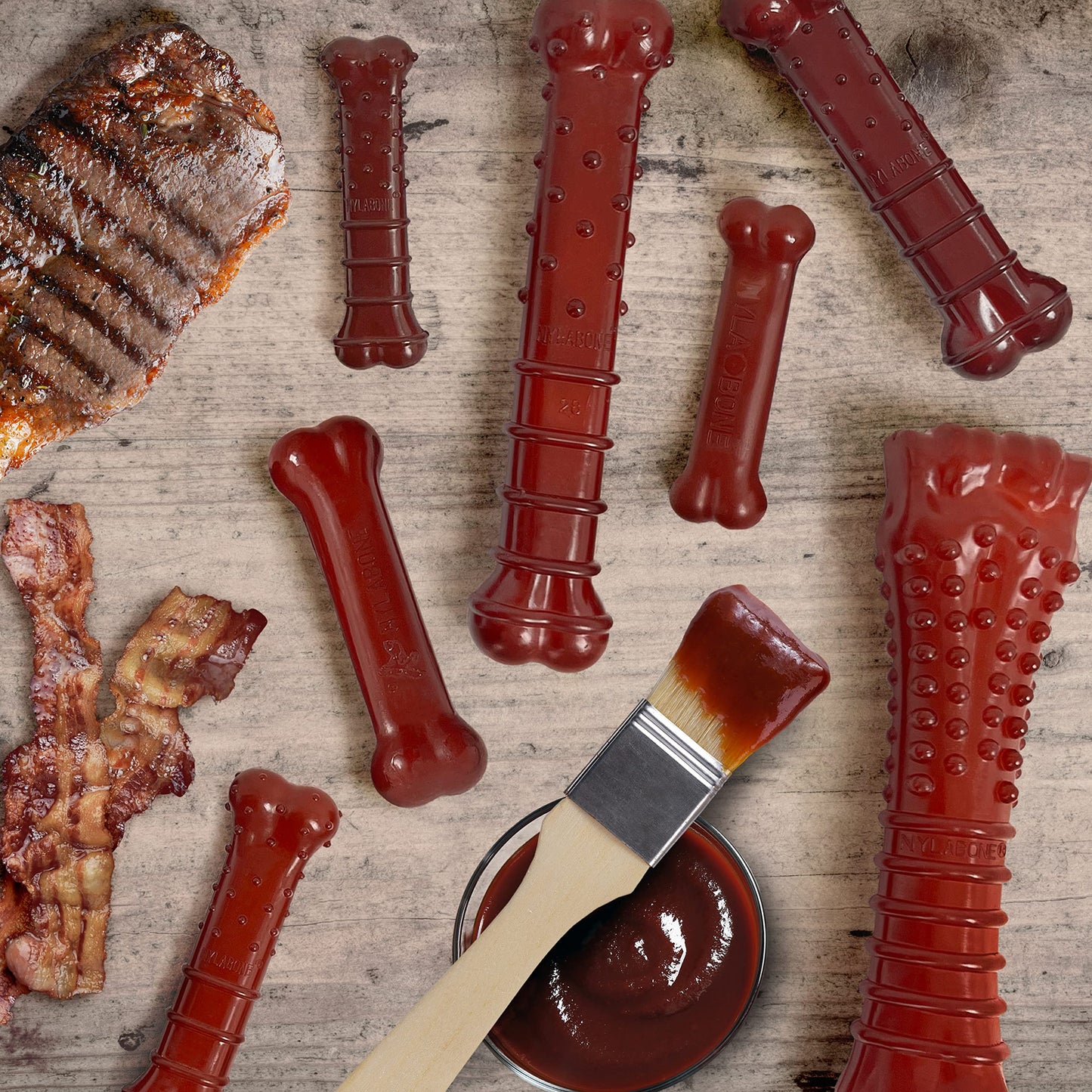 Juguete Masticar Huesos Nylabone Tocino y Sabor a Bistec Mediano para Perros Masticadores Agresivos