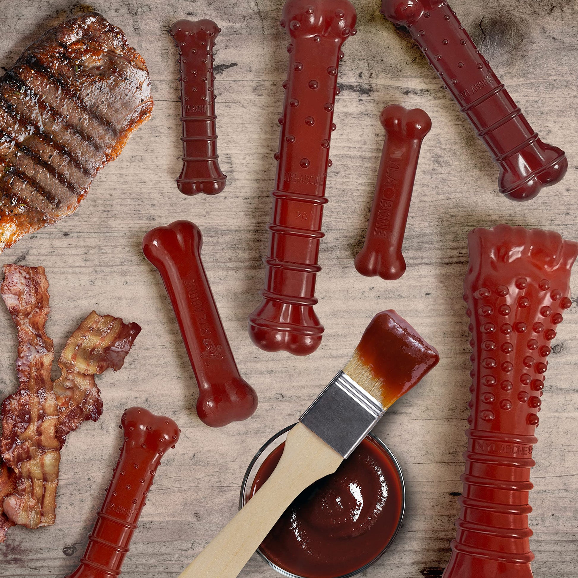 Juguete Masticar Huesos Nylabone Tocino y Sabor a Bistec Mediano para Perros Masticadores Agresivos