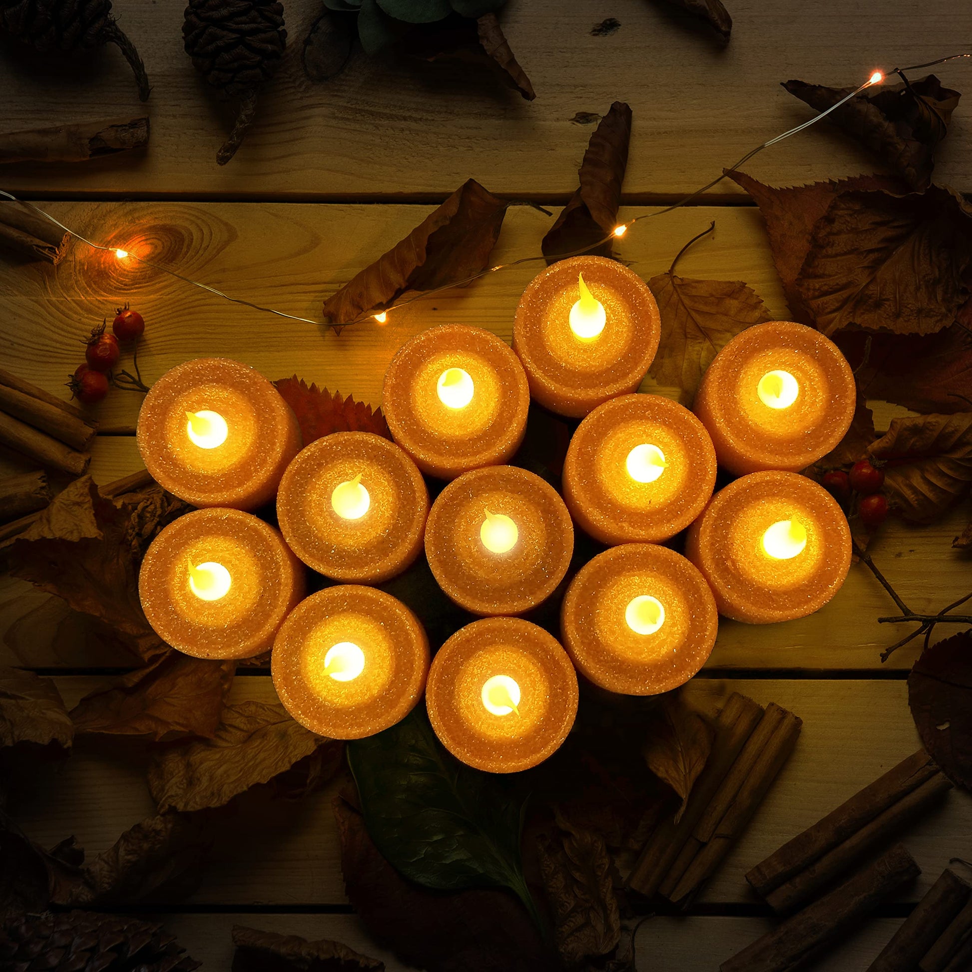 FURORA LIGHTING - Velas LED con purpurina naranja, paquete de 12, velas parpadeantes sin llama para decoración del hogar, 1.5 pulgadas de ancho x 1.65 pulgadas de alto, funciona con pilas